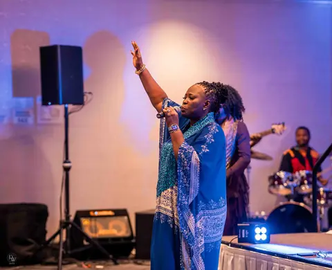 Worship leader, arm raised