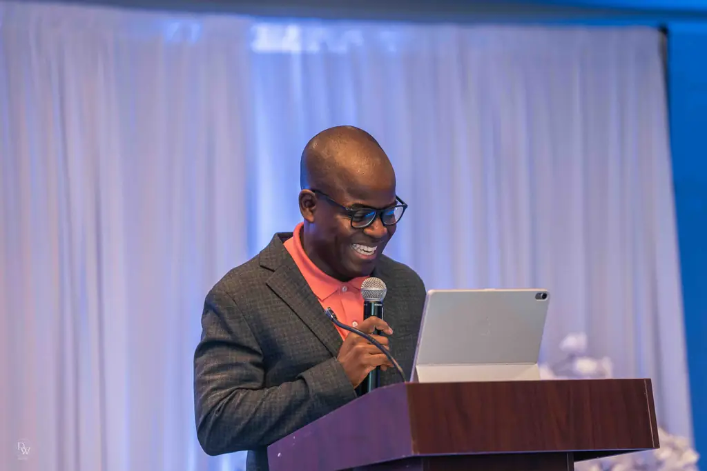 A preacher laughing at the pulpit