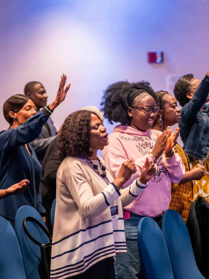 Women clapping and worshipping together